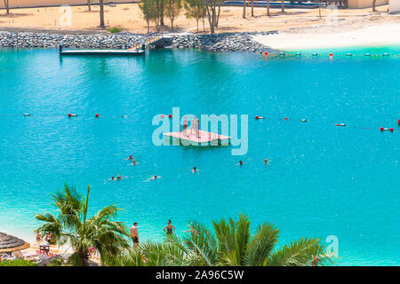 Abu Dhabi, UAE - April 1. 2019. Beautiful resort area overlooking pool and sea Stock Photo