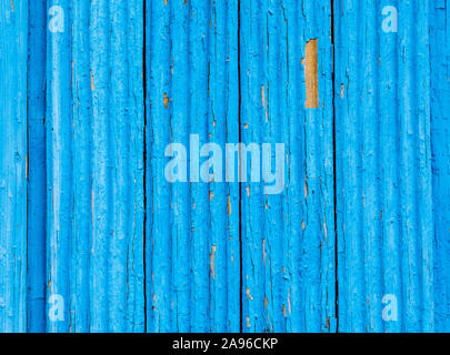 Old rough wooden boards with cracks as background. Wooden planks texture with the shabby blue paint Stock Photo