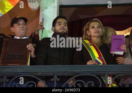 (191113) -- LA PAZ, Nov. 13, 2019 (Xinhua) -- Jeanine Anez (R) wears the presidential sash after proclaiming herself interim president in La Paz, Bolivia, on Nov. 12, 2019. Opposition senator Jeanine Anez assumed on Tuesday the presidency of the Bolivian Senate, which has allowed her to also proclaim herself interim president of the country. (Photo by Meagan Hancock/Xinhua) Stock Photo