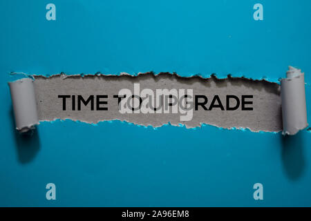Time To Upgrade Text written in torn paper Stock Photo