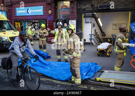 London, UK. 13 November, 2019. Emergency services attend an incident at Oxford Circus London Underground station. The station was evacuated and cordoned off and the Victoria Line suspended during the incident. British Transport Police later confirmed that a casualty had been taken to a local hospital after suffering potentially life-threatening injuries. Another person is also understood to have been treated by paramedics at the scene. Credit: Mark Kerrison/Alamy Live News Stock Photo