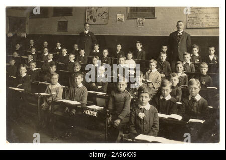 Original early 1900's school boys sitting in classroom, circa 1910,  studio of J.& G Taylor, Green Lane, N. London, U.K. Stock Photo