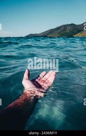 Hand in the water. Stock Photo