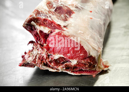 Close up on a cut of raw prime Entrecote steak for roasting at a butchery, shop or restaurant Stock Photo