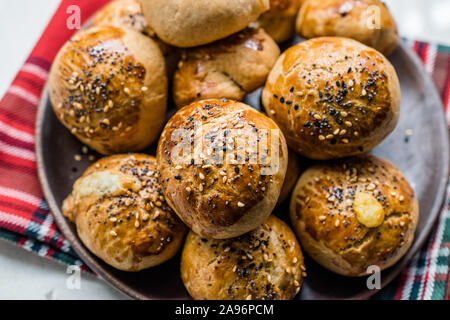 Homemade Turkish Pastries Pogaca with Black Cumin and Sesame Seeds. Traditional Organic Food. Stock Photo