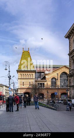 Budapest Hungary 03 16 2019 passengers waiting for the trolley bus in front of the Budapest Central Market Hall Stock Photo