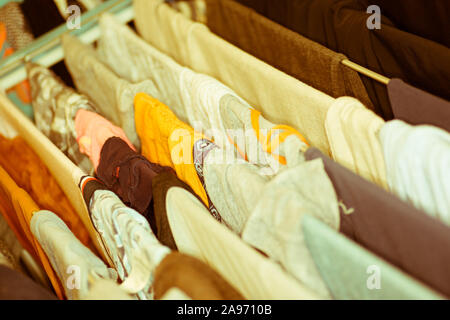 Colourful laundry drying on airer inside the house Stock Photo