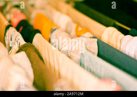 Colourful laundry drying on airer inside the house Stock Photo