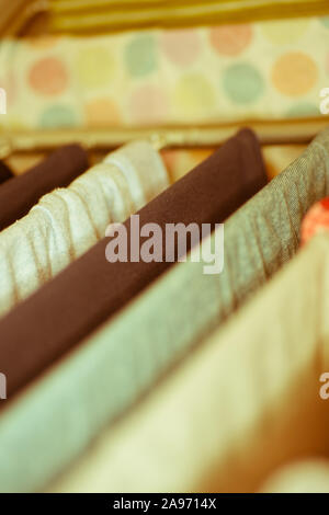 Colourful laundry drying on airer inside the house Stock Photo