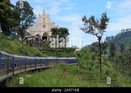 (191113) -- COLOMBO, Nov. 13, 2019 (Xinhua) -- People travel by a Chinese-made train in Sri Lanka, Nov. 2, 2019. Sri Lanka has always been regarded by travel enthusiasts as 'a country with the most beautiful railway network in the world.'   TO GO WITH 'Feature: Chinese-made train makes mountain rail travel in Sri Lanka smoother than ever' (Xinhua/Tang Lu)