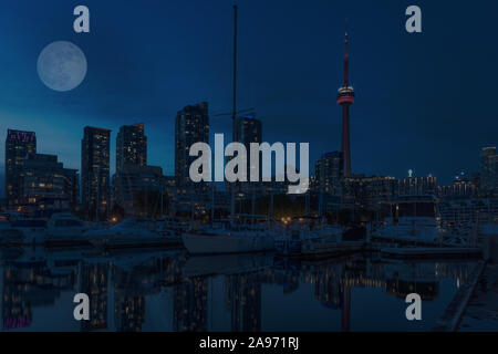 Canada, Ontario, Toronto at Night, the moon is shinning, yachts weigh soft in the water Stock Photo