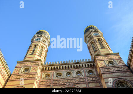 Front side facade of the Great Synagogue in Hungarian Budapest. Dohany Street Synagogue, the largest synagogue in Europe. Centre of Neolog Judaism. Ornamental facade and two onion domes. Tourist spot. Stock Photo
