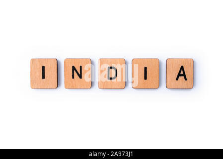 The word INDIA, spelt with wooden letter tiles over a white background. Stock Photo