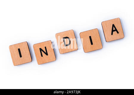 The word INDIA, spelt with wooden letter tiles over a white background. Stock Photo