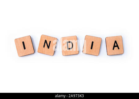 The word INDIA, spelt with wooden letter tiles over a white background. Stock Photo
