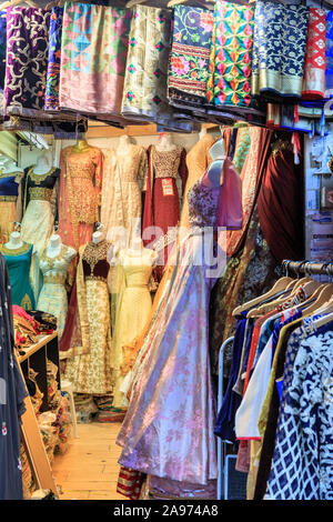 Colourful Asian and Indian dresses, saris and fashion on display in shop, Southall High Street, London, UK Stock Photo