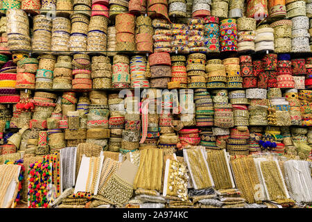 Asian and Indian clothing trims and dress borders in gold and brocade with colourful stitching detail on display Stock Photo