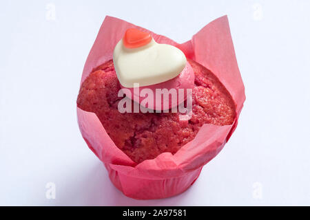 Percy Pig heart sweet muffin fresh from M&S in-store bakery isolated on white background Stock Photo