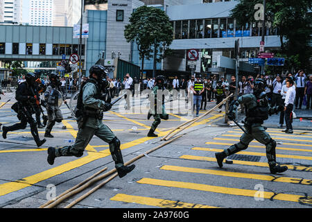 Hong Kong, China. 13th Nov, 2019. Riot police in action during a protest in the Central district Hong Kong. A ''Blossom Everywhere'' action was organized by the protestors to paralyze traffic and vandalize things across Hong Kong and in its third consecutive days and have sparked some of the worst violence in five months of unrest. Credit: Keith Tsuji/ZUMA Wire/Alamy Live News Stock Photo