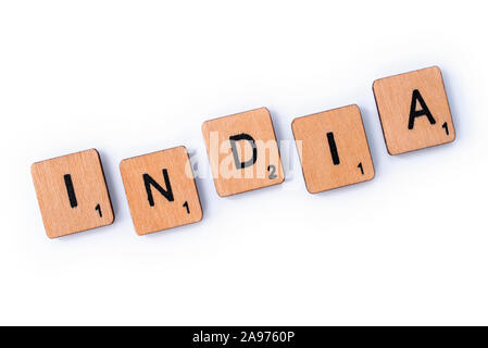 London, UK - July 8th 2019: The word INDIA, spelt with wooden letter tiles over a white background. Stock Photo