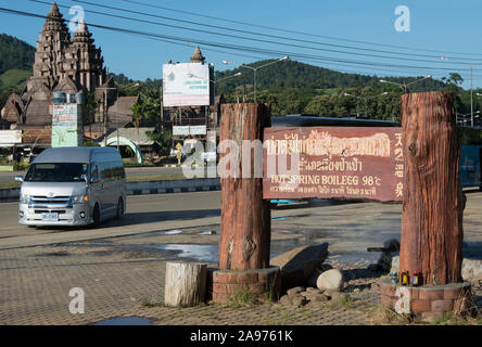 sign in thai, english and chinese welcoming visitors to the hot springs of pha soet, chiang rai province, northern thailand Stock Photo