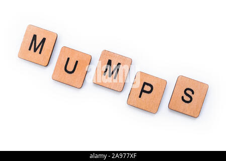 The word MUMPS, spelt with wooden letter tiles over a white background ...