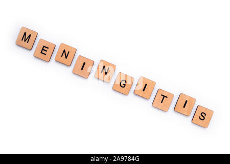 The word MENINGITIS, spelt with wooden letter tiles over a white background. Meningitis is an infection of the protective membranes that surround the Stock Photo