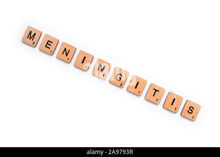 London, UK - June 16th 2019: The word MENINGITIS, spelt with wooden letter tiles over a white background. Meningitis is an infection of the protective Stock Photo