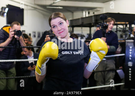 London, UK. 13th Nov, 2019. Liberal Democrat Leader, Jo Swinson wearing boxing gloves at Total Boxer in north London.Total Boxer is a specialised boxing gym in Crouch End which offers training to young people as a means of keeping them away from violence. Jo Swinson announced £500 million to tackle soaring levels of knife crime after boxing with the owner of Total Boxer. Credit: SOPA Images Limited/Alamy Live News Stock Photo