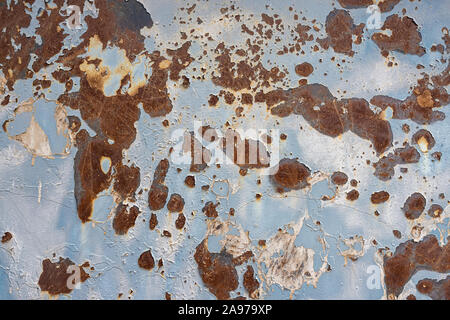 Light blue sheet metal plate with rust spots and stains. Stock Photo