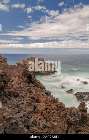Volcanic rocks coastline, long exposure photography, Atlantic ocean,Frontera, El Hierro island, Canary islands, Spain Stock Photo