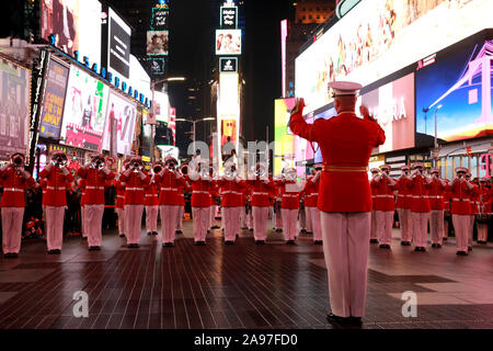 The U.S. Marine Drum and Bugle Corps conduct a musical ballad at Times Square in honor of the Marine Corps’ 244th Birthday November 10, 2019 in New York City, New York. Stock Photo