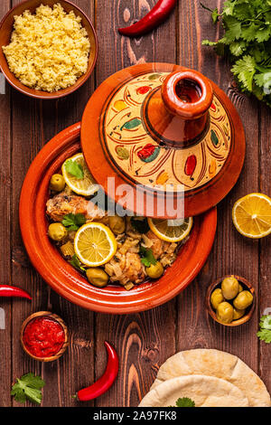 Traditional moroccan tajine of chicken with salted lemons, olives. Top view. Stock Photo