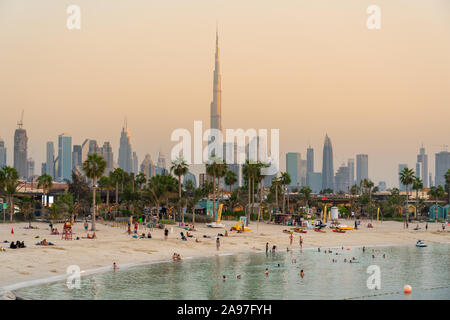 View of the Burji Khalifa and downtown Dubai from the beach along Jumeira Public Beach during sunset. Stock Photo