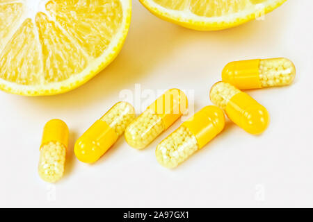 Vitamin c pills and lemons Stock Photo