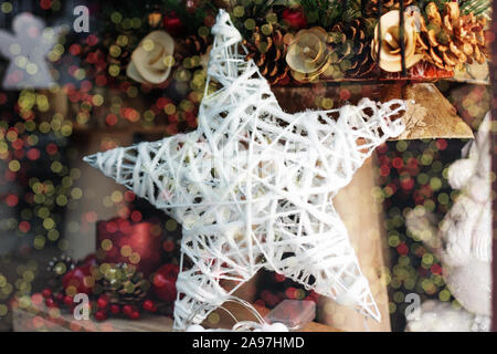 Hanging whit wooden christmas snowflake toy. Beautiful Christmas decoration. Stock Photo