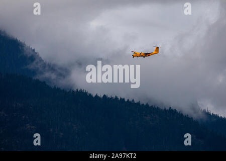 A Canada Search and Rescue CC-115 Buffalo air plane circles around Pemberton during a training mission on a cloudy fall day. Stock Photo