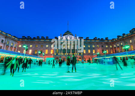 Somerset House, London, UK, 13th November 2019. Visitors enjoy skating on the pristine ice in the beautifully illuminated surroundings of Somerset House, as the annual 'SKATE' ice rink opens to the public. The outdoor area also features a bar and viewing area. Somerset House ice rink will be open 13th Nov 2019 - 12th Jan 2020 Credit: Imageplotter/Alamy Live News Stock Photo