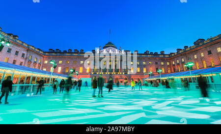 Somerset House, London, UK, 13th November 2019. Visitors enjoy skating on the pristine ice in the beautifully illuminated surroundings of Somerset House, as the annual 'SKATE' ice rink opens to the public. The outdoor area also features a bar and viewing area. Somerset House ice rink will be open 13th Nov 2019 - 12th Jan 2020 Credit: Imageplotter/Alamy Live News Stock Photo