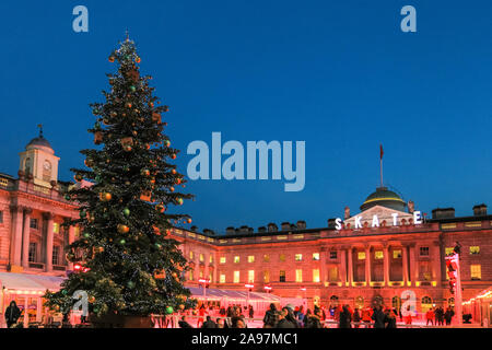 Somerset House, London, UK, 13th November 2019. Visitors enjoy skating on the pristine ice in the beautifully illuminated surroundings of Somerset House, as the annual 'SKATE' ice rink opens to the public. The outdoor area also features a bar and viewing area. Somerset House ice rink will be open 13th Nov 2019 - 12th Jan 2020 Credit: Imageplotter/Alamy Live News Stock Photo