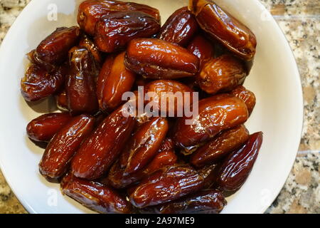Dried dates in a bowl Stock Photo