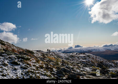 Hikers walking an alpine mountain landscape at the Kungsleden, Lapland, Sweden Stock Photo