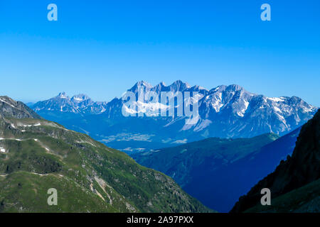 Massive mountain range of Schladming Alps, Austria. The slopes of Alps are steep, partially overgrown with green bushes. Dangerous mountain climbing.C Stock Photo