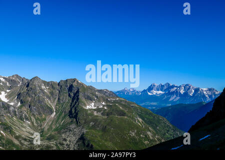 Massive mountain range of Schladming Alps, Austria. The slopes of Alps are steep, partially overgrown with green bushes. Dangerous mountain climbing.C Stock Photo