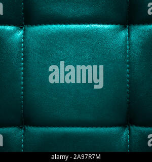 Shiny dark turquoise artificial textured leather stitched with thread. Close-up of sofa surface. View from directly above. Highly detailed square back Stock Photo