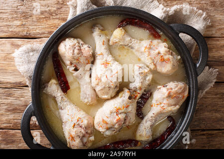 White chicken curry served in a pan. Country style. Indian food. Horizontal top view from above Stock Photo