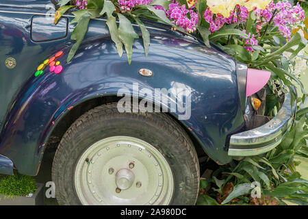Old car decorated with fresh flowers.: Keukenhof, the Netherlands - April 09, 2019 Stock Photo