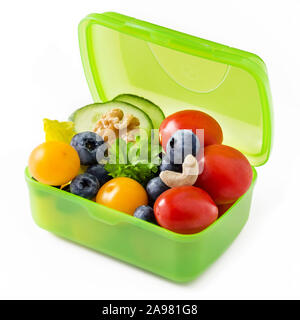 Snack box with fruits and nuts isolated against white backgroun Stock Photo