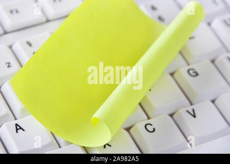 Yellow  paper and keyboard background Stock Photo