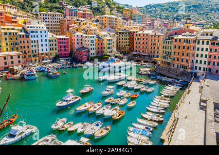 Aerial view of Camogli. Colorful buildings near the ligurian sea beach. View from above on boats and yachts moored in marina with green blue water. Stock Photo